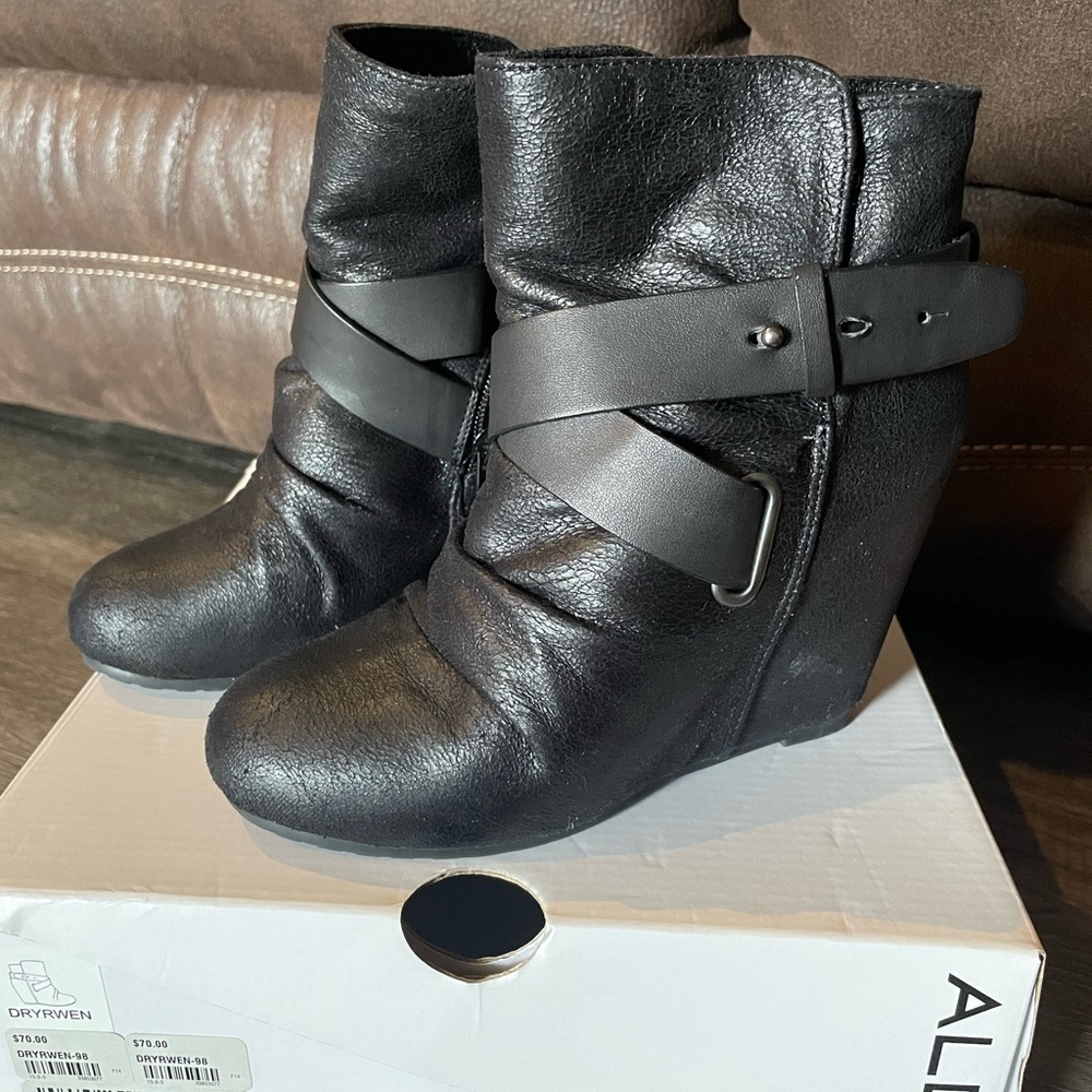 Black Aldo heeled booties.